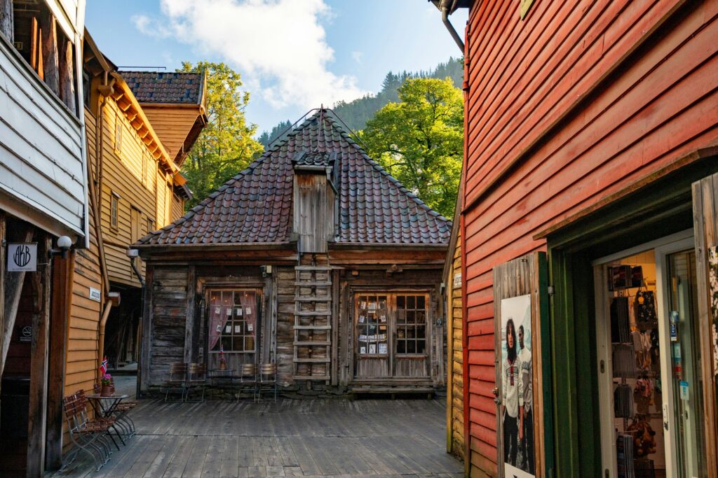 Historic wooden buildings in Bryggen, Bergen's old wharf area, on a sunny day.